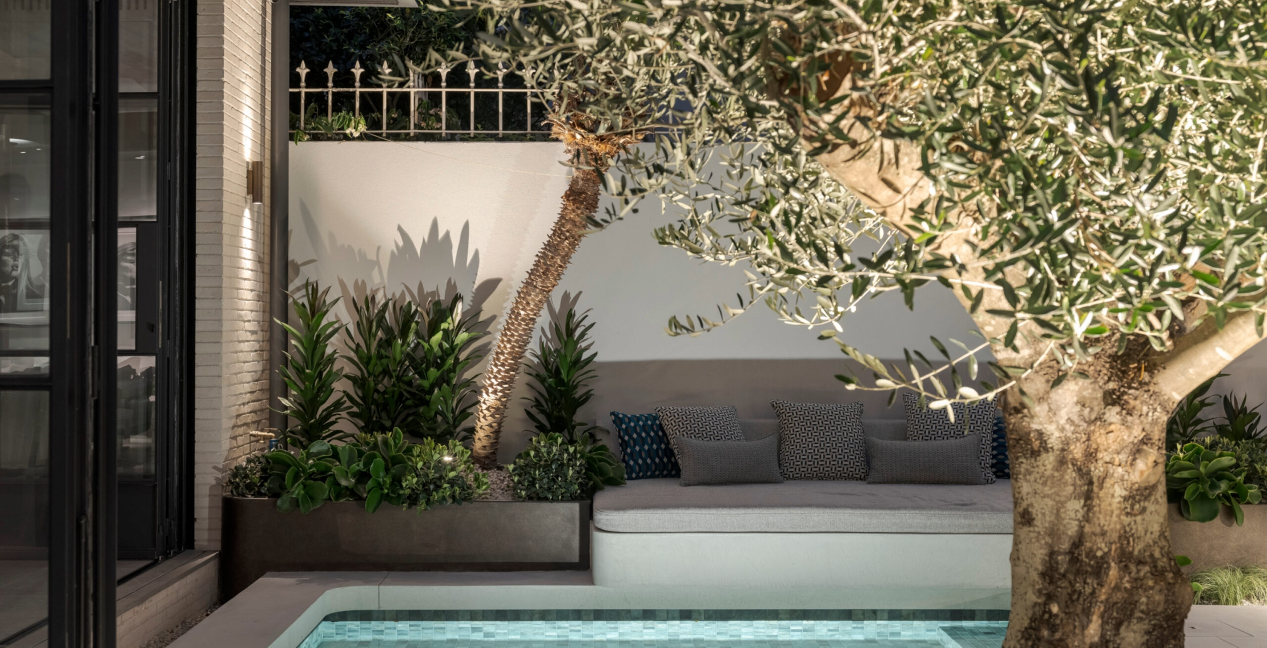 Luxury pool landscaping project in Sydney with modern stone finishes and coastal planting.